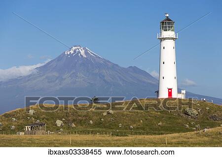 Stock Photography - "Cape Egmont Lighthouse with Mount Taranaki, Pungarehu, Taranaki Region, New Zealand, Oceania". Fotosearch
