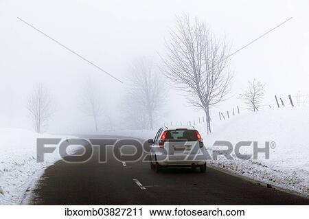 "Car on a country road in a snow-covered landscape, fog, Bergneustadt, North Rhine-Westphalia, Germany, Europe" View Large Photo Image Stock Image - "Car on a country road in a snow-covered landscape, fog, Bergneustadt, North Rhine-Westphalia, Germany, Europe". Fotosearch