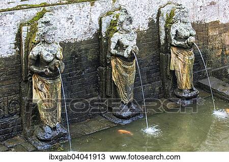 Stock Image - "Carved granite statues in the ritual bathing pool, Goa Gajah Elephant Cave, Bali, Indonesia, Asia". Fotosearch