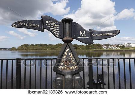 Stock Photograph - "Cast-iron signpost on the River Foyle, Londonderry, County Derry, Northern Ireland, Great Britain, Europe, PublicGround". Fotosearch