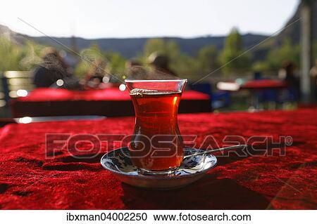 Stock Image - "Cay, black tea in a tulip glass, Anatolia, Turkey, Asia". Fotosearch