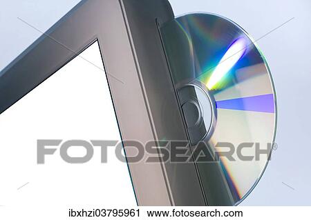 Stock Image - CD in the drive of a computer. Fotosearch