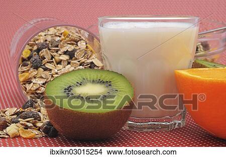 "Cereal or muesli, a glass of milk, a kiwi and an orange" View Large Photo Image Picture - "Cereal or muesli, a glass of milk, a kiwi and an orange". Fotosearch