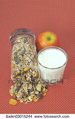 Picture - "Cereal or muesli, a glass of milk and an apple". Fotosearch