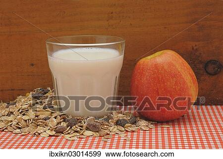 "Cereal or muesli, a glass of milk and an apple" View Large Photo Image Stock Photo - "Cereal or muesli, a glass of milk and an apple". Fotosearch