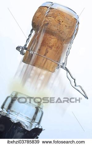 Champagne cork popping out of a champagne bottle View Large Photo Image Stock Photo - Champagne cork popping out of a champagne bottle. Fotosearch