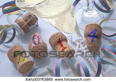 Stock Photo - "Champagne corks and champagne, New Years Eve 2014". Fotosearch