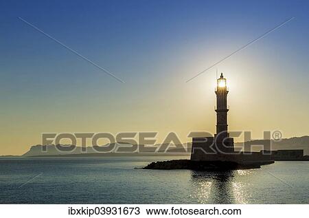 "Chania lighthouse with the sun right behind, at sunrise, harbour, Chania, Crete, Greece, Europe" View Large Photo Image Stock Image - "Chania lighthouse with the sun right behind, at sunrise, harbour, Chania, Crete, Greece, Europe". Fotosearch