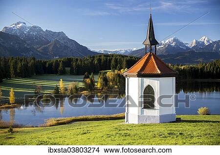 "Chapel at Hegratsrieder See lake on an autumn morning, Ostallgau, Bavaria, Germany, Europe" View Large Photo Image Picture - "Chapel at Hegratsrieder See lake on an autumn morning, Ostallgau, Bavaria, Germany, Europe". Fotosearch