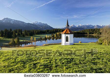 "Chapel at Hegratsrieder See lake on an autumn morning, Ostallgau, Bavaria, Germany, Europe" View Large Photo Image Stock Photo - "Chapel at Hegratsrieder See lake on an autumn morning, Ostallgau, Bavaria, Germany, Europe". Fotosearch
