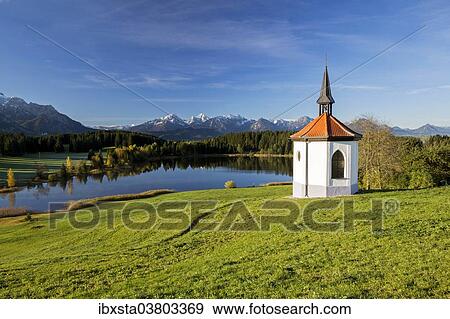 "Chapel at Hegratsrieder See lake on an autumn morning, Ostallgau, Bavaria, Germany, Europe" View Large Photo Image Stock Photo - "Chapel at Hegratsrieder See lake on an autumn morning, Ostallgau, Bavaria, Germany, Europe". Fotosearch