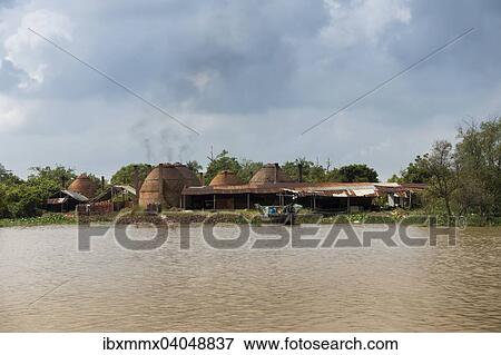 "Charcoal burning in the Mekong Delta, Can Tho, Vietnam, Asia" View Large Photo Image Stock Photo - "Charcoal burning in the Mekong Delta, Can Tho, Vietnam, Asia". Fotosearch