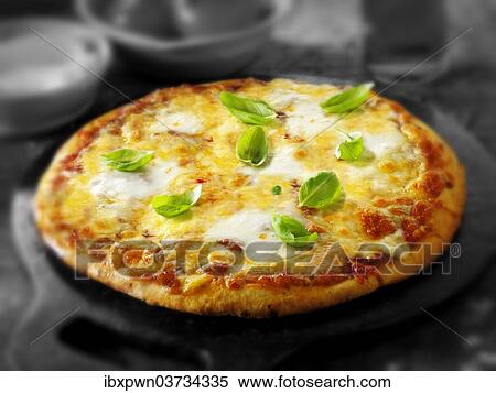 Cheese and tomato thin crust pizza View Large Photo Image Stock Photography - Cheese and tomato thin crust pizza. Fotosearch
