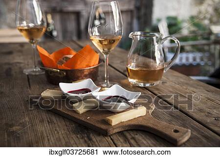 "Cheese platter with dips, bread basket, wine glasses and wine jug, Tirano, Sondrio province, Lombardy, Italy, Europe" View Large Photo Image Stock Image - "Cheese platter with dips, bread basket, wine glasses and wine jug, Tirano, Sondrio province, Lombardy, Italy, Europe". Fotosearch