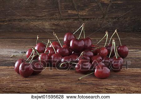 Cherries on rustic wood View Large Photo Image Stock Photo - Cherries on rustic wood. Fotosearch