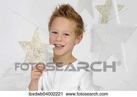 "Child, boy wearing an angel costume with stars, Christmas, festive season" View Large Photo Image Stock Image - "Child, boy wearing an angel costume with stars, Christmas, festive season". Fotosearch