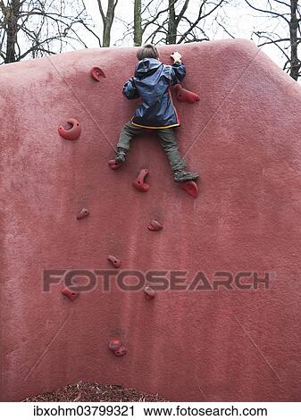 "Child climbing on a climbing wall, Brandenburg, Germany, Europe" View Large Photo Image Stock Image - "Child climbing on a climbing wall, Brandenburg, Germany, Europe". Fotosearch