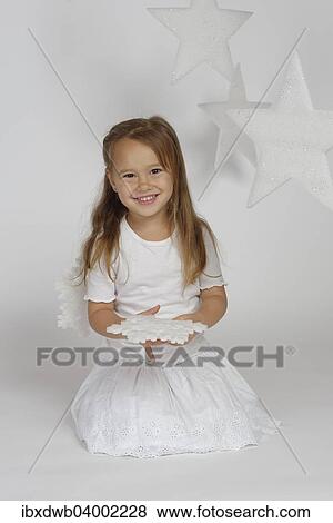 "Child, girl wearing an angel costume with stars, Christmas, festive season" View Large Photo Image Stock Photo - "Child, girl wearing an angel costume with stars, Christmas, festive season". Fotosearch