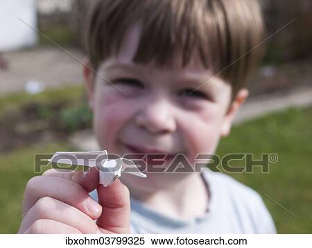 "Child holding a paper airplane, in the garden, Germany, Europe" View Large Photo Image Stock Photography - "Child holding a paper airplane, in the garden, Germany, Europe". Fotosearch