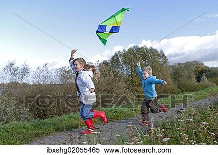 "Children flying a kite, kiteflying, Hitzacker, Lower Saxony, Germany, Europe" View Large Photo Image Stock Photography - "Children flying a kite, kiteflying, Hitzacker, Lower Saxony, Germany, Europe". Fotosearch