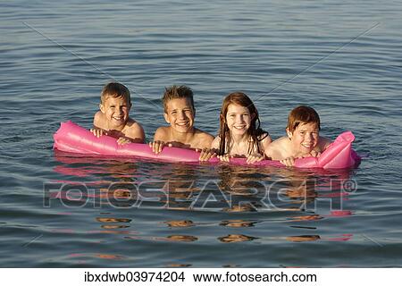 "Children on a lilo in the sea, Mediterranean near Fano, Marche, Adriatic, Italy, Europe" View Large Photo Image Picture - "Children on a lilo in the sea, Mediterranean near Fano, Marche, Adriatic, Italy, Europe". Fotosearch