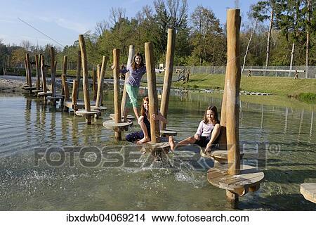 "Children playing at the Erlebnispark Wasser Fisch Natur adventure park, at Murner See lake, near Wackersdorf, Upper Palatinate Lake District, Upper Palatinate, Bavaria, Germany, Europe" View Large Photo Image Picture - "Children playing at the Erlebnispark Wasser Fisch Natur adventure park, at Murner See lake, near Wackersdorf, Upper Palatinate Lake District, Upper Palatinate, Bavaria, Germany, Europe". Fotosearch