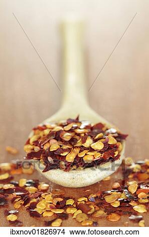 Picture - Chilli flakes on spoon. Fotosearch