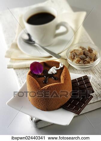 "Chocolate cake with a sponge case and chocolate filling, covered with cocoa powder" View Large Photo Image Stock Image - "Chocolate cake with a sponge case and chocolate filling, covered with cocoa powder". Fotosearch