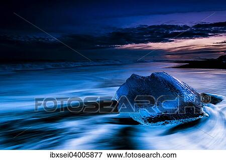 "Chunk of ice on black lava sand beach at the blue hour, Jokulsarlon lake, Vik, Iceland, Europe" View Large Photo Image Stock Photo - "Chunk of ice on black lava sand beach at the blue hour, Jokulsarlon lake, Vik, Iceland, Europe". Fotosearch