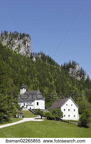 Stock Photography - "Church and the mountain climbers' cemetery in Johnsbach, Gesaeuse region, Ennstaler Alps, Upper Styria, Styria, Austria, Europe, PublicGround, Europe". Fotosearch