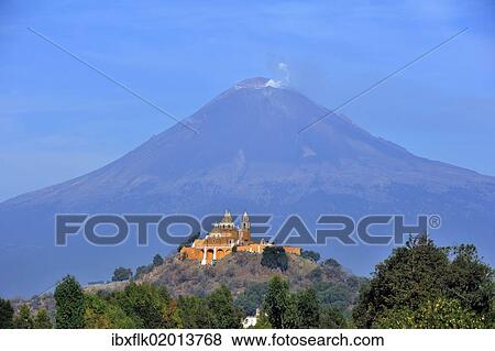"Church of Iglesia Nuestra Senora de los Remedios on the ruins of the pre-Hispanic Pyramid of Cholula in front of the active volcano Popocatepetl, San Pedro Cholula, Puebla, Mexico, Latin America, North America" View Large Photo Image Stock Photo - "Church of Iglesia Nuestra Senora de los Remedios on the ruins of the pre-Hispanic Pyramid of Cholula in front of the active volcano Popocatepetl, San Pedro Cholula, Puebla, Mexico, Latin America, North America". Fotosearch
