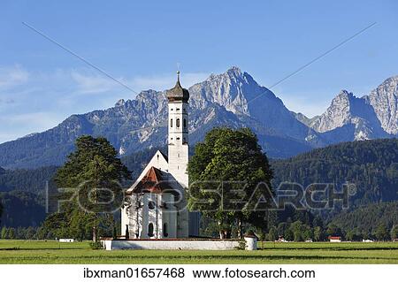 Stock Photo - "Church of St. Coloman or Colomanskirche, Schwangau, in front of the Tannheimer Mountains, Ostallgaeu, Allgaeu, Schwaben, Bavaria, Germany, Europe". Fotosearch