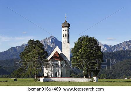 Stock Photo - "Church of St. Coloman or Colomanskirche, Schwangau, in front of the Tannheimer Mountains, Ostallgaeu, Allgaeu, Schwaben, Bavaria, Germany, Europe". Fotosearch