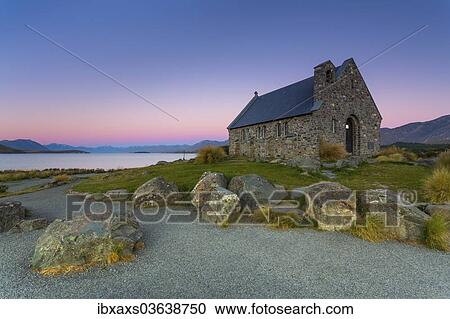 Stock Image - "Church of the Good Shepherd at Lake Tekapo at the blue hour, behind the Southern Alps, Lake Tekapo, Canterbury Region, New Zealand, Oceania". Fotosearch