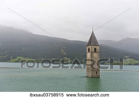 "Church tower in the Reschensee lake, Graun im Vinschgau, South Tyrol province, Trentino-Alto Adige, Italy, Europe" View Large Photo Image Stock Photography - "Church tower in the Reschensee lake, Graun im Vinschgau, South Tyrol province, Trentino-Alto Adige, Italy, Europe". Fotosearch