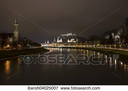Stock Photo - "Cityscape, night view from the Salzach with Hohensalzburg Fortress and Cathedral, Salzburg, Austria, Europe". Fotosearch