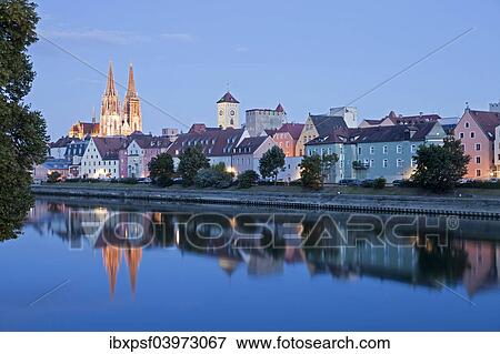 Stock Photo - "Cityscape with the Danube, historic centre, the clock tower of the Old Town Hall and Regensburg Cathedral, at night, Regensburg, Bavaria, Germany, Europe". Fotosearch