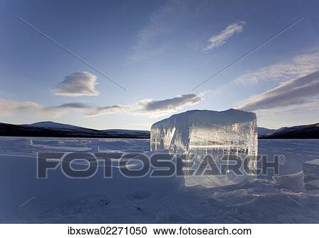 "Clear ice cube on frozen Fish Lake, cut out with a chain saw, Yukon Territory, Canada, North America" View Large Photo Image Stock Image - "Clear ice cube on frozen Fish Lake, cut out with a chain saw, Yukon Territory, Canada, North America". Fotosearch