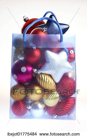 Clear plastic bag filled with Christmas decorations View Large Photo Image Picture - Clear plastic bag filled with Christmas decorations. Fotosearch
