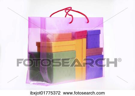 Clear plastic bag filled with colorful paper gift boxes View Large Photo Image Stock Image - Clear plastic bag filled with colorful paper gift boxes. Fotosearch