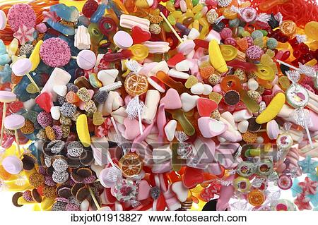 "Clear plastic bags with a variety of fruit gums, marshmallows, candies, lollipops, cookies and gummy bears" View Large Photo Image Stock Photo - "Clear plastic bags with a variety of fruit gums, marshmallows, candies, lollipops, cookies and gummy bears". Fotosearch