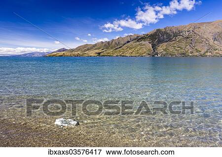 "Clear waters of Lake Hawea, Hunter Valley, Otago Region, New Zealand, Oceania" View Large Photo Image Stock Photo - "Clear waters of Lake Hawea, Hunter Valley, Otago Region, New Zealand, Oceania". Fotosearch