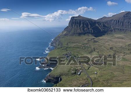 "Cliffs and a small village, Gasadalur, Vagar, Faroe Islands, Denmark, Europe" View Large Photo Image Stock Image - "Cliffs and a small village, Gasadalur, Vagar, Faroe Islands, Denmark, Europe". Fotosearch