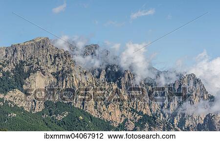 "Cliffs and rocks in front of clouds, Col de Bavella Bavella Massif, Corsica, France, Europe" View Large Photo Image Stock Image - "Cliffs and rocks in front of clouds, Col de Bavella Bavella Massif, Corsica, France, Europe". Fotosearch