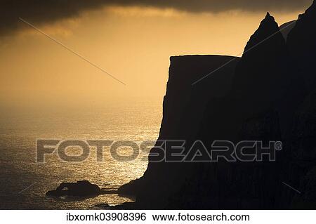 "Cliffs and sea in evening light, near Lopra, Suouroy, Faroe Islands, Denmark, Europe" View Large Photo Image Stock Photograph - "Cliffs and sea in evening light, near Lopra, Suouroy, Faroe Islands, Denmark, Europe". Fotosearch