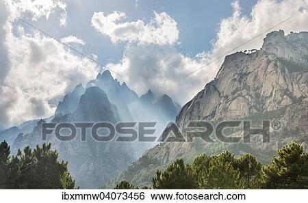 Stock Photograph - "Cliffs in clouds, Col de Bavella, Bavella Massif, Corsica, France, Europe". Fotosearch