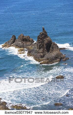 Stock Photo - "Cliffs in the Anaga Mountains with the Playa de Roque de las Bodegas beach, Almaciga, Almaciga, Tenerife, Canary Islands, Spain, Europe". Fotosearch