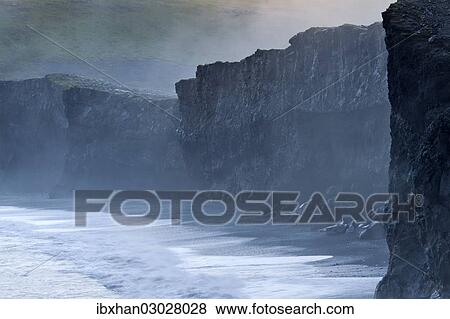 Stock Photo - "Cliffs in the evening light, Dyrholaey, Vik i Myrdal, Southern Region, Iceland, Europe". Fotosearch
