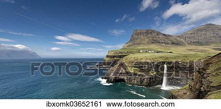 "Cliffs with a waterfall near a village, Mykines Island at the rear, Gasadalur, Vagar, Faroe Islands, Denmark, Europe" View Large Photo Image Stock Image - "Cliffs with a waterfall near a village, Mykines Island at the rear, Gasadalur, Vagar, Faroe Islands, Denmark, Europe". Fotosearch