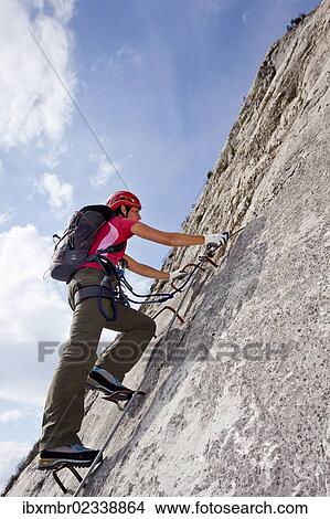 "Climber climbing the Che Guevara climbing route on Monte Casale in Sarca Valley, Lake Garda region, Trentino, Italy, Europe" View Large Photo Image Picture - "Climber climbing the Che Guevara climbing route on Monte Casale in Sarca Valley, Lake Garda region, Trentino, Italy, Europe". Fotosearch